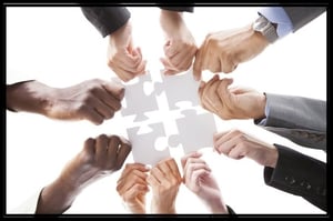 teamwork-puzzle-organized-pieces-together-frame